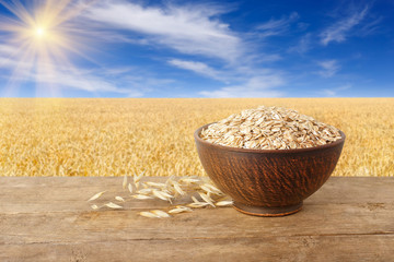 Wall Mural - uncooked oatmeal in bowl