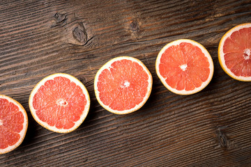 Sticker - Red grapefruits on an old wooden table