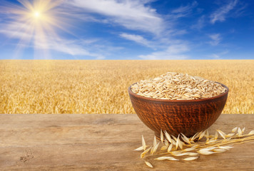 Wall Mural - ears of oats and oat grains in bowl