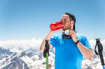 A traveler drinks water