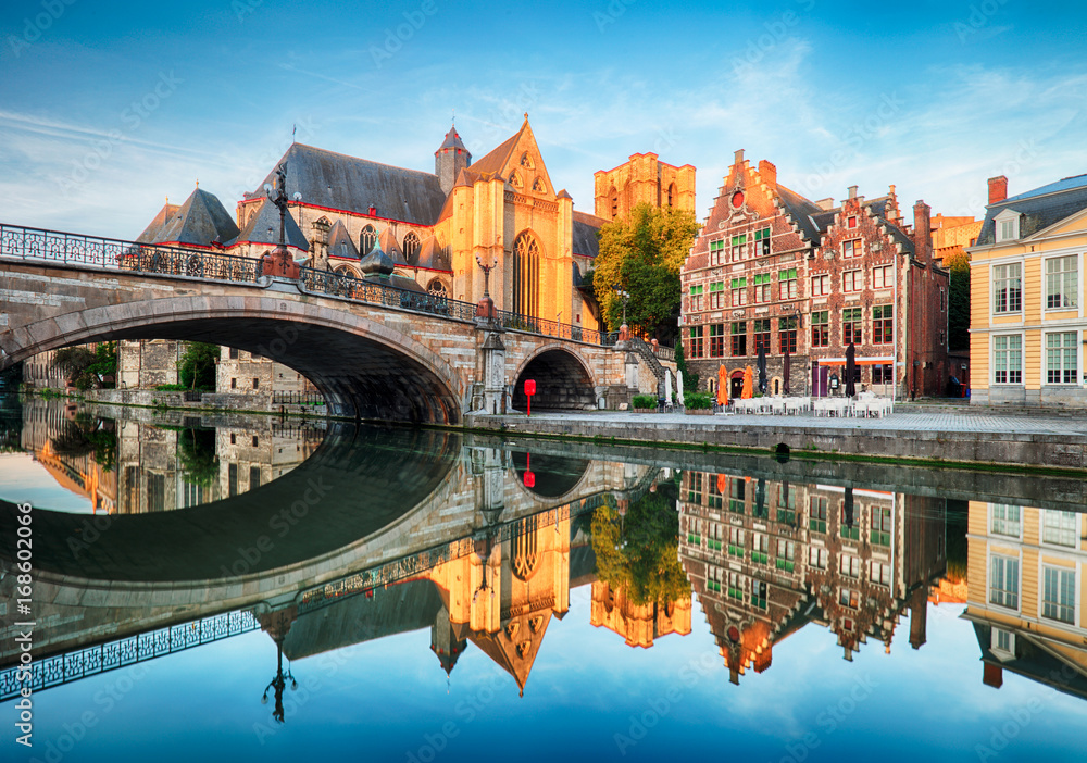 Medieval cathedral and bridge over a canal in Ghent - Gent, Belgium - obrazy, fototapety, plakaty 