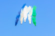 Group of fighter jet airplane with a trace of white smoke against a blue sky