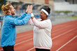 © pressmaster - Trainer congratulating one of his trainees on sport achievement