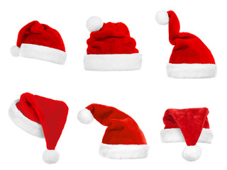 Wall Mural - Collage of Santa's hats on white background