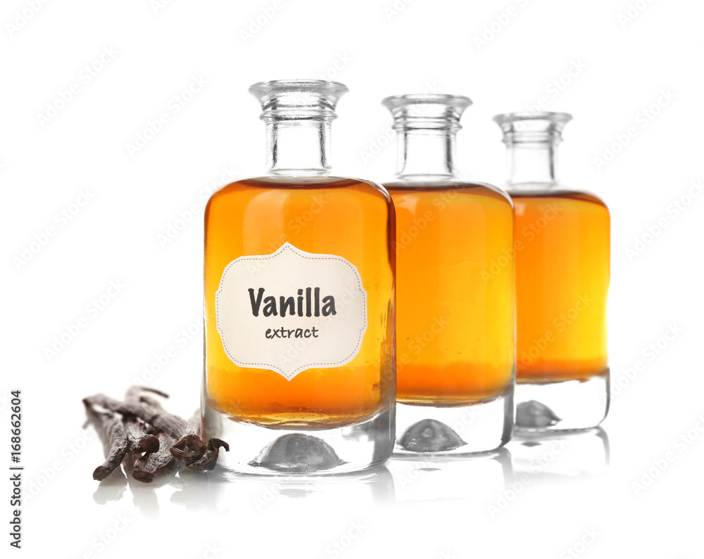 Bottles with aromatic extract and dry vanilla beans on white background