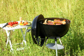 Canvas Print - Picnic with barbecue grill outdoors