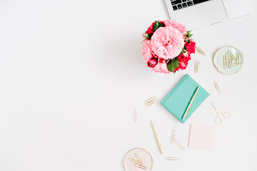 Wall Mural - Flat lay home office desk. Female workspace with laptop, pink and red roses bouquet, golden accessories, mint diary on white background. Top view feminine background.