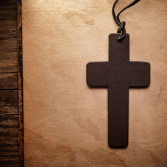 Wall Mural - Closeup of wooden Christian cross on bible