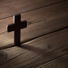 Canvas Print - wooden cross on wood background