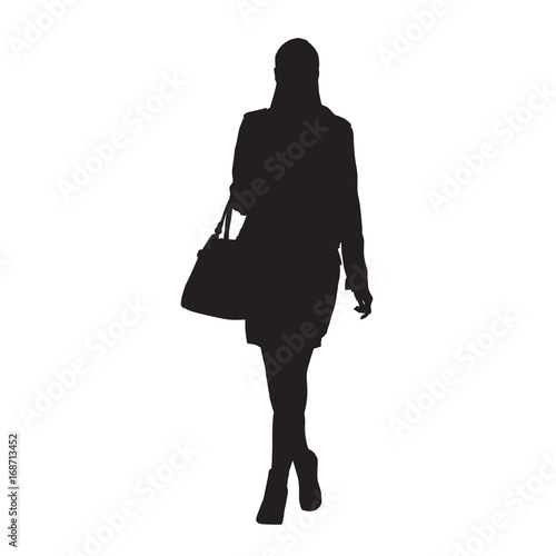 Woman Walking And Holding Handbag Or Purse In Her Hand This Woman Walking And Holding Handbag Or Purse In Her Hand