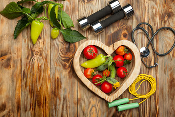 Vegetables in the heart. Diet, healthy lifestyle on a rustic wooden background