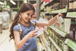© Yakobchuk Olena - Cheerful smiling little girl in store