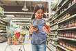 © Yakobchuk Olena - Joyous smiling small lady shopping