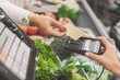 © Yakobchuk Olena - Buyer giving plastic card to cashier