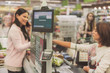 © Yakobchuk Olena - Customer locating near cash desk in supermarket