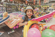 © Yakobchuk Olena - Hilarious laughing small girl in store