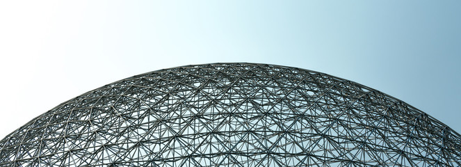 Dome shape structure with a blue and gray sky