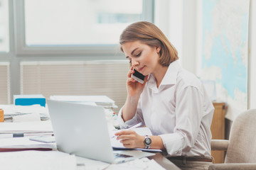 Wall Mural - Young businesswoman at the office