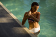 © BGStock72 - Young woman in the swimming pool