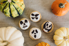 French Macarons With Ghost Faces For Halloween