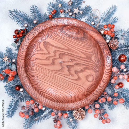 Round Wooden Tray Surrounded With Decorations On Snow Round Wooden Tray Surrounded With Decorations On Snow
