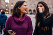 © JaymeBurrows/Stocksy - Two Young Women Laughing at a Smart Phone