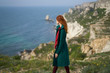 © SHOTPRIME STUDIO - Beautiful young woman on a cliff above the sea, nature