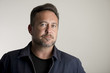 © photographyfirm - Adult Man in Jacket Over Gray Background with Copy Space