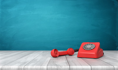 Wall Mural - 3d rendering of a bright red dial phone standing on a wooden desk and a blue wall background.