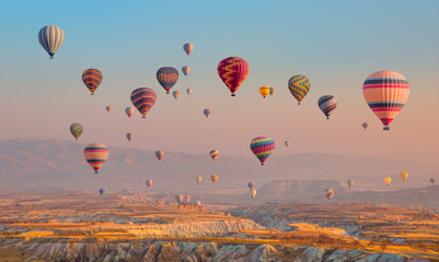 Hot air balloon flying over spectacular Cappadocia