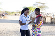 © Hugh Sitton - Nurse examing patient in rural village. Kenya, Africa