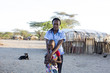 © Hugh Sitton - Portrait of nurse and girl standing in rural village