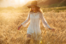 Gorgeous Young Woman Standing In The Field