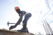 © Hugh Sitton - Man working on construction site. Kenya, Africa