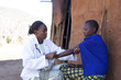 © Hugh Sitton - Doctor examining female patient. Kenya,  Africa