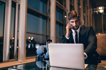 Poster - Businessman waiting for his flight at airport lounge