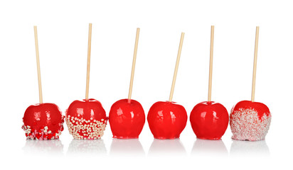 Sticker - Delicious candy apples on white background