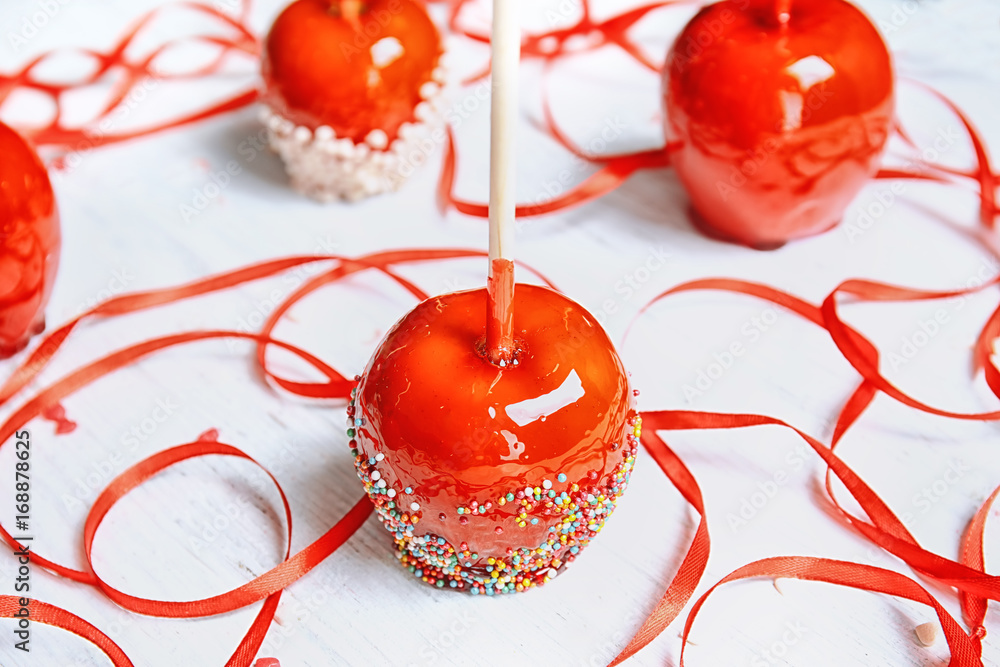 Delicious candy apples on table