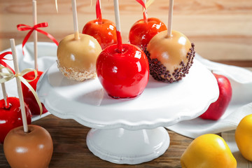 Sticker - Ceramic stand with delicious candy apples on table