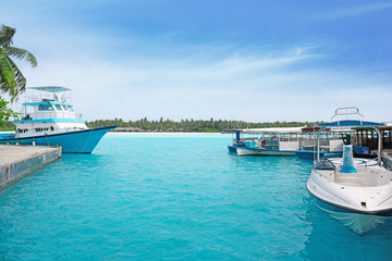 Canvas Print - Modern boats berthed at tropical resort