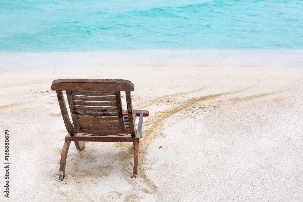Beach chair on sea shore at resort