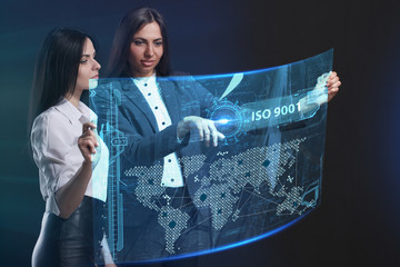 The concept of business, technology, the Internet and the network. A team of business women working on the virtual screen of the future and see the inscription: ISO 9001