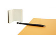 book pencil and orange paper isolated