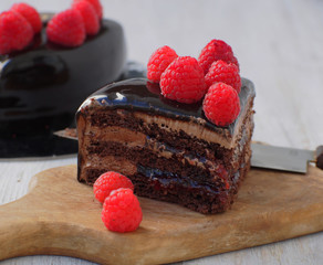 Chocolatee cake.Sweet pie with fresh raspberries