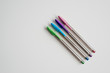 Minimalist composition of four pens of different colors. Back to school photography