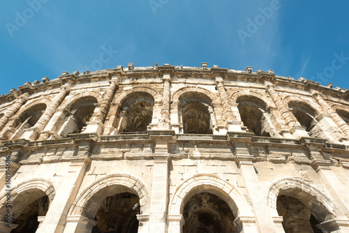 Fotografie, Obraz Arena of Nimes, Roman Empire landmark in Nimes city of Occitanie region, Franc