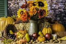 Thanksgiving Cornucopia Of Fruits Nuts Pumpkins Fall Flowers And Autumn Leaves