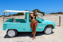 Sexy Woman In Bikini Posing At Blue Car
