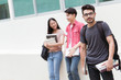 © torwaiphoto - Handsome student and friends are reading books at the university library