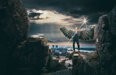 Wall Mural - Angel Standing on Rocks Above City